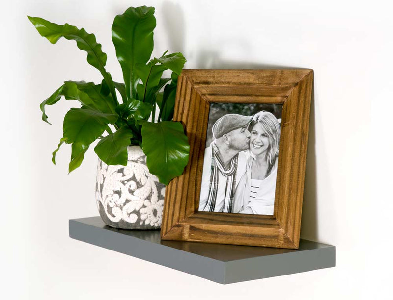 Castle Timbers Grey Floating Shelf with picture frame and plant on top