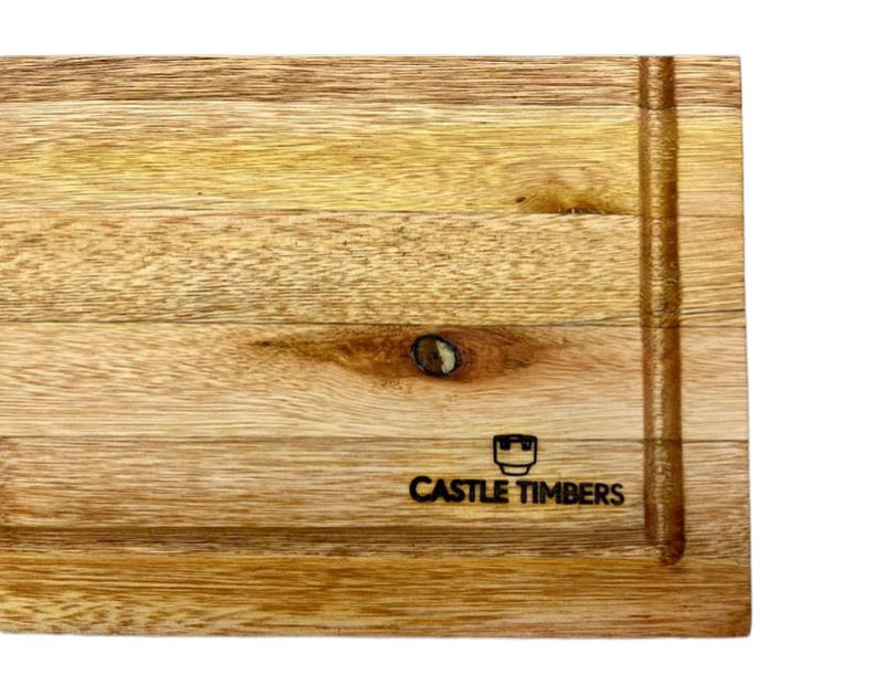 Pine chopping board with Castle Timbers logo