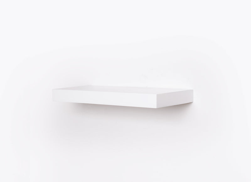 A standard white econo floating shelf